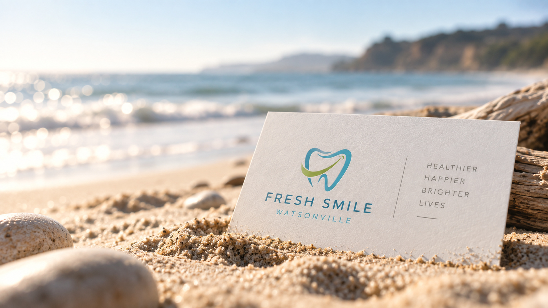 Fresh Smile Watsonville business card on the beach